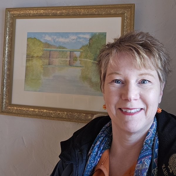 Sandra Woods with her painting, at Trestler House, 19.12.2024